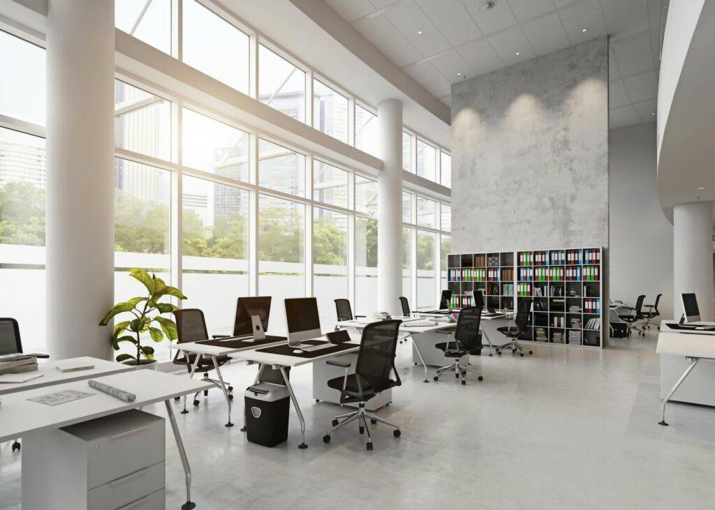 Technicians installing office network cables and Wi-Fi equipment for Broward company